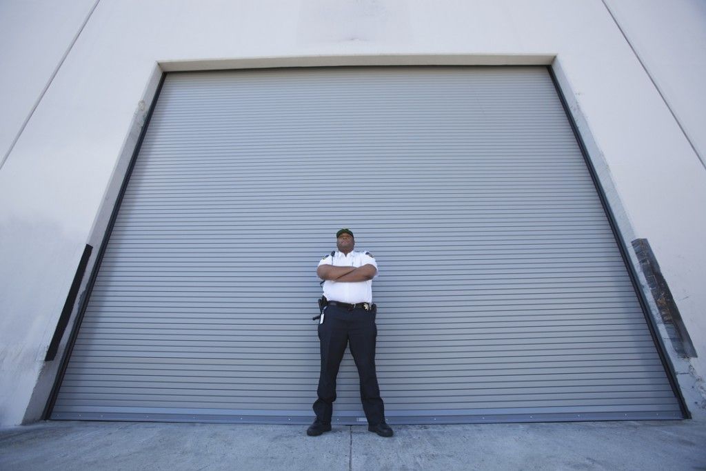 Security Guard in front of door.