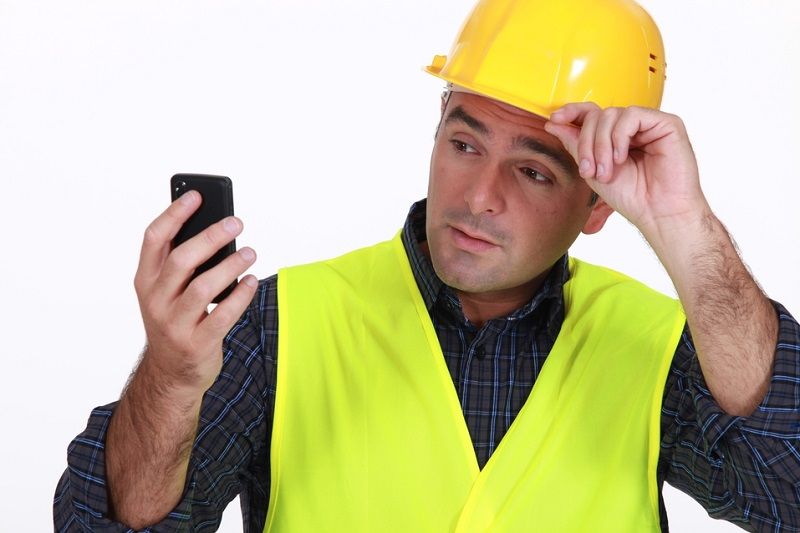 construction worker on phone