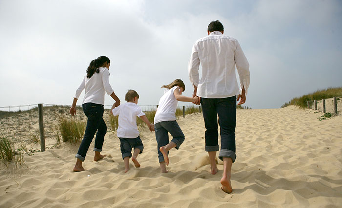 family walking on beach