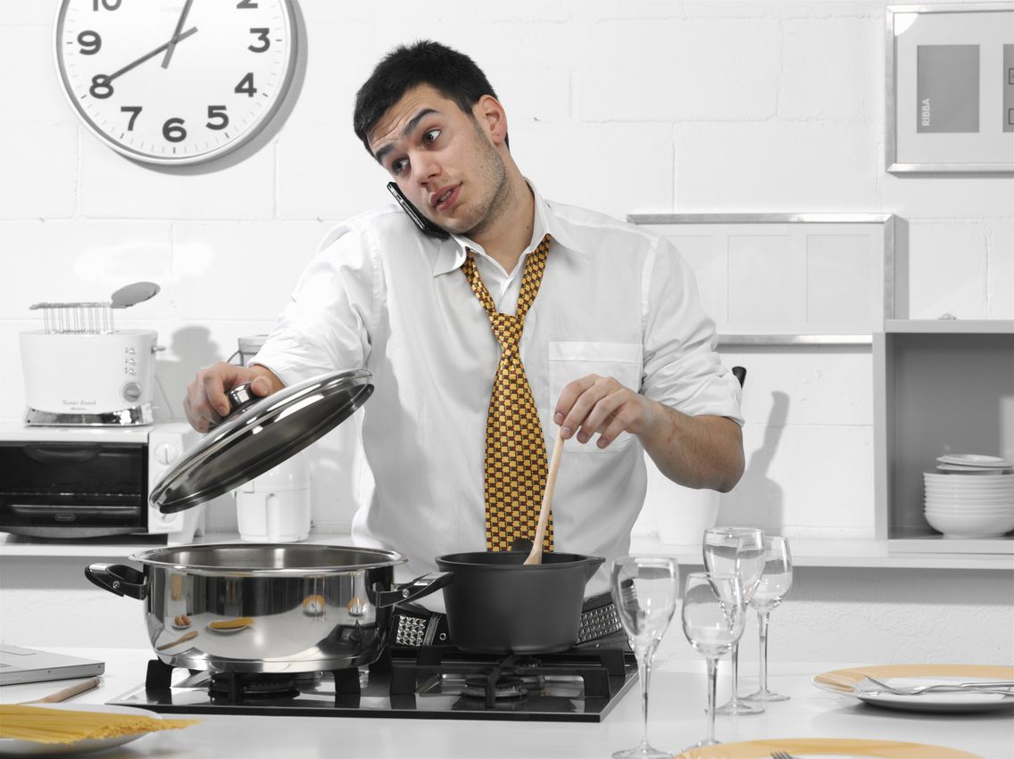 business man in the kitchen talking on the phone